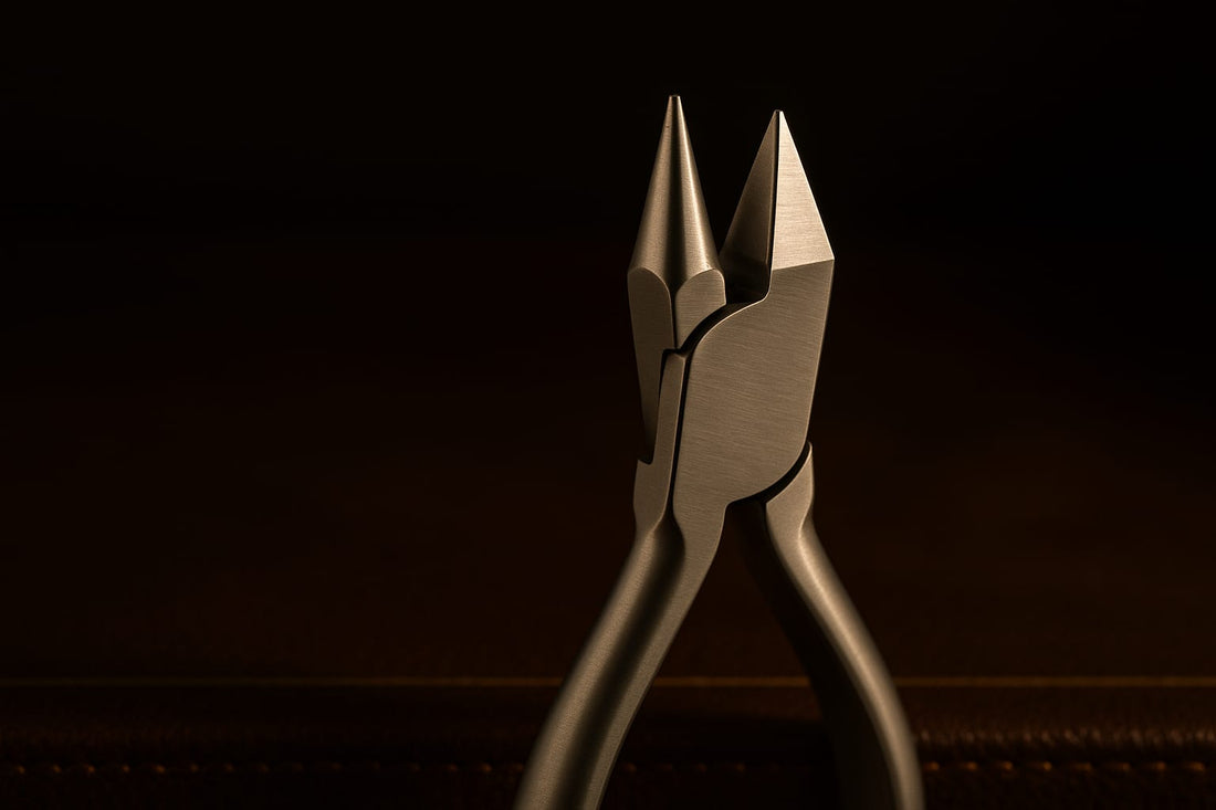 Bird beak orthodontic plier standing upright in golden light on espresso leather